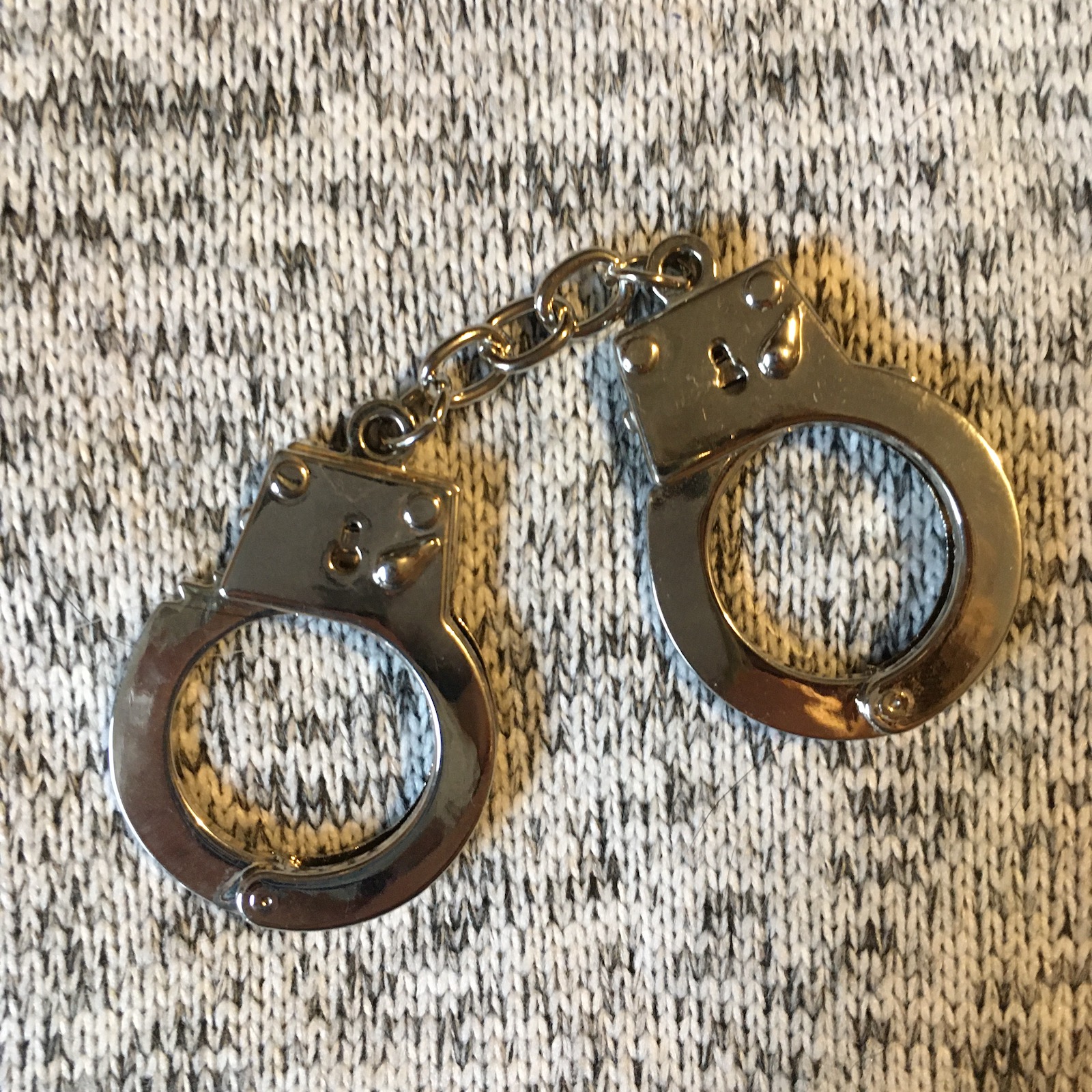Metal mini handcuffs keychain.